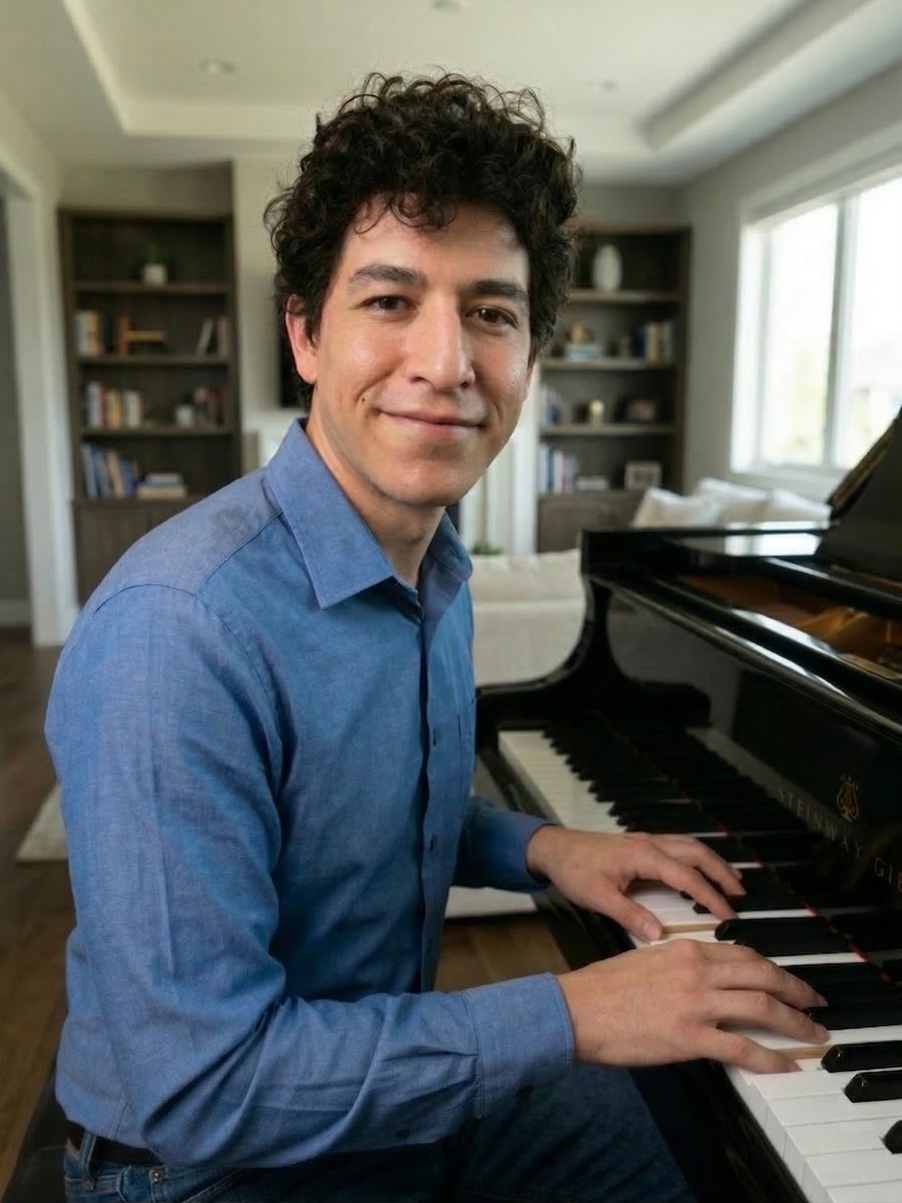 Gavin Hammond, piano teacher in Albuquerque NM, seated at a grand piano